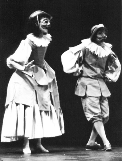 2 dancers in  masks cosume Arlecchinette and Arlecchino.. Black and white photo 