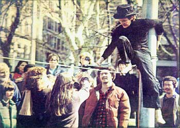 Philippe Petit wearing custom top hat walking the hi-wire 